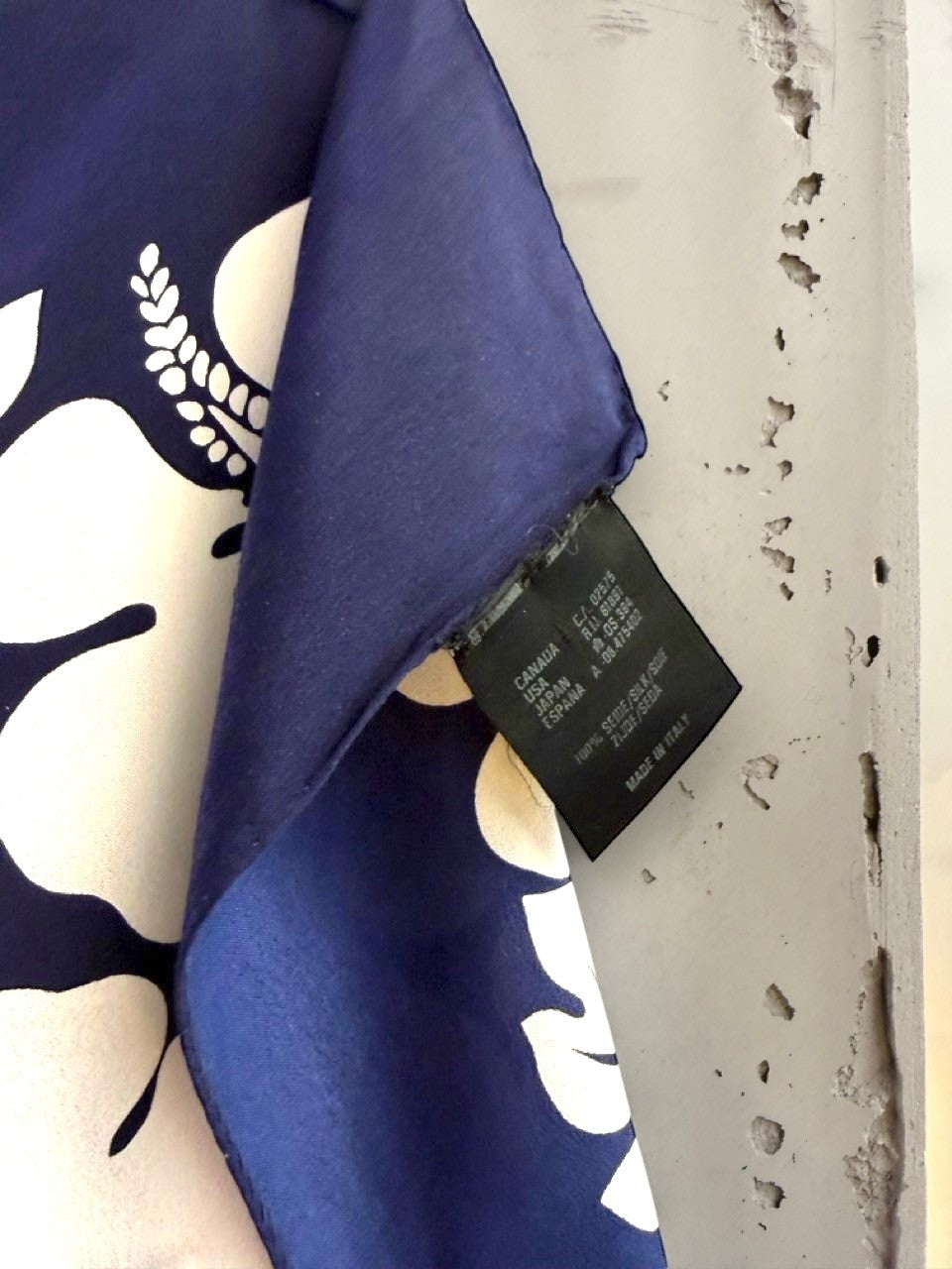BERLIN VINTAGE CORNER Escada vintage navy blue and white floral silk scarf with Italian-made fabric care label.