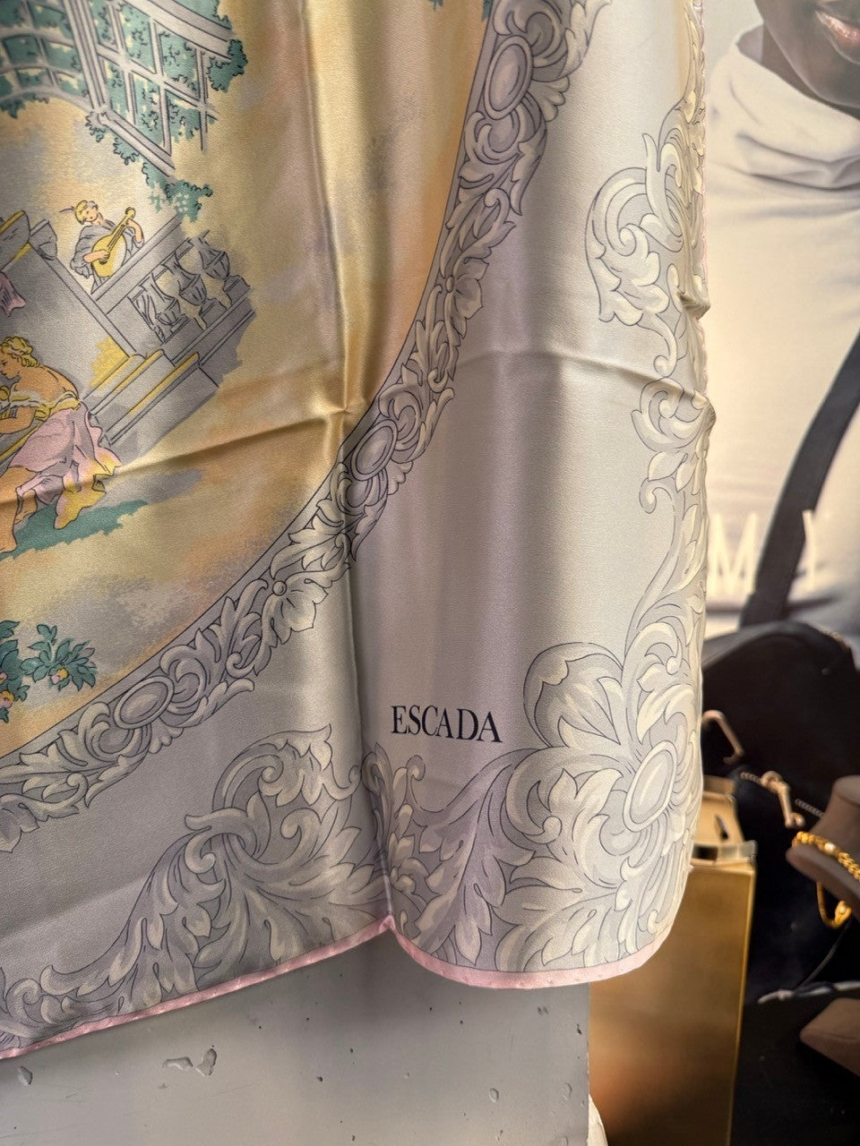 BERLIN VINTAGE CORNER Escada silk scarf featuring a pastoral scene with scrollwork border in yellow and grey tones.