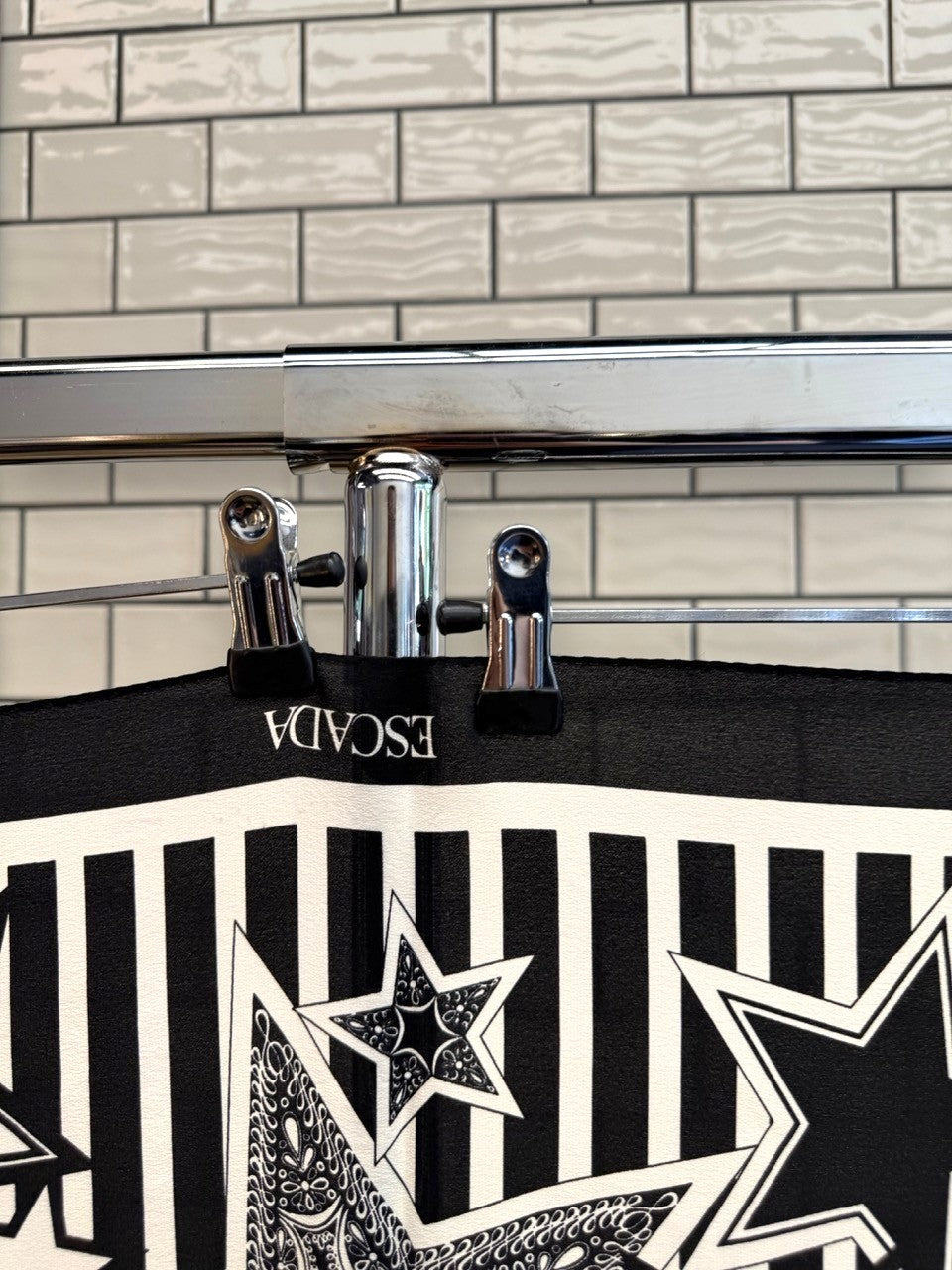 BERLIN VINTAGE CORNER ESCADA black and white silk scarf featuring graphic star motifs and vertical stripes.