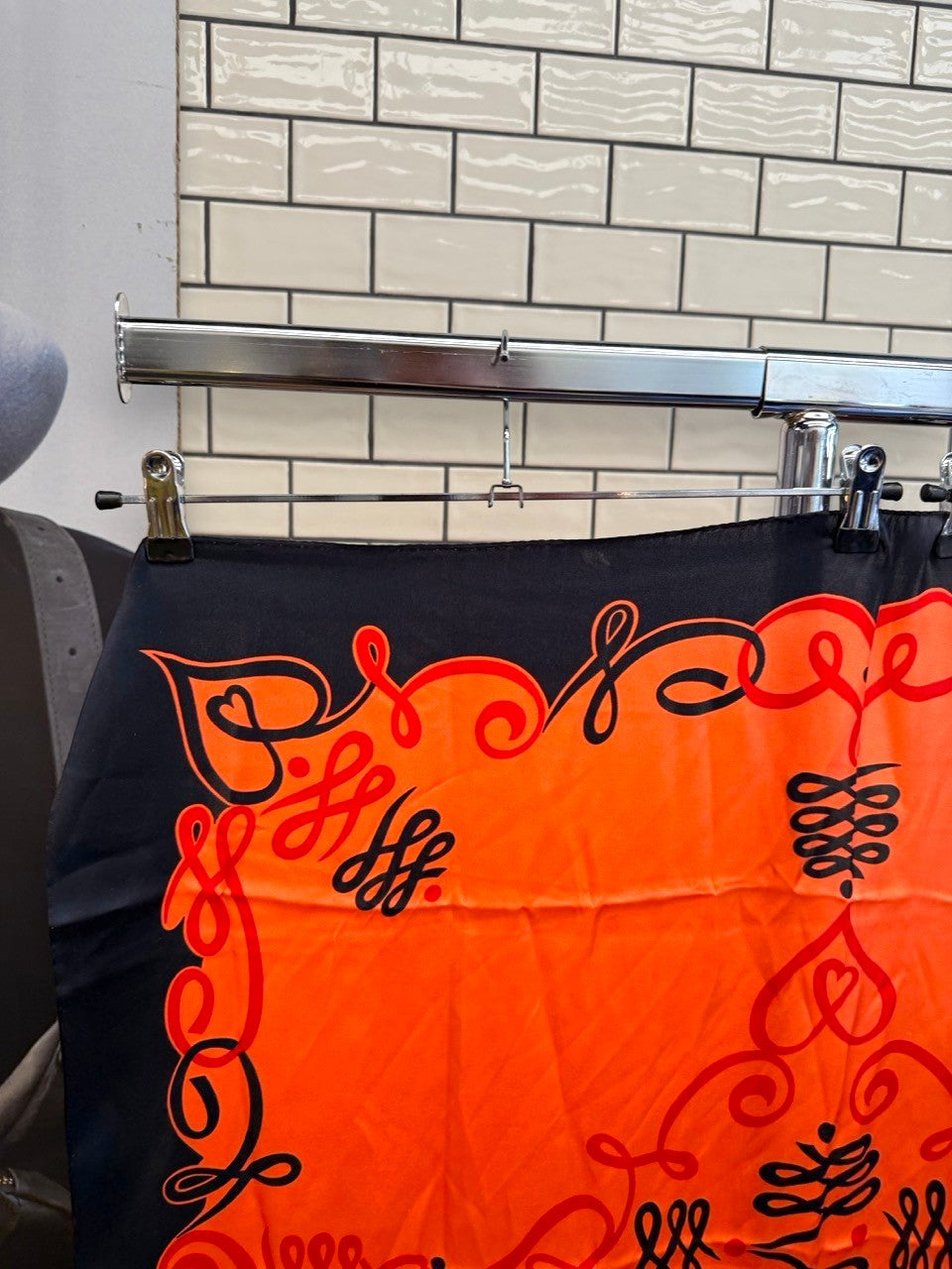 BERLIN VINTAGE CORNER vintage ESCADA silk scarf in vibrant orange and black with ornate scrollwork patterns