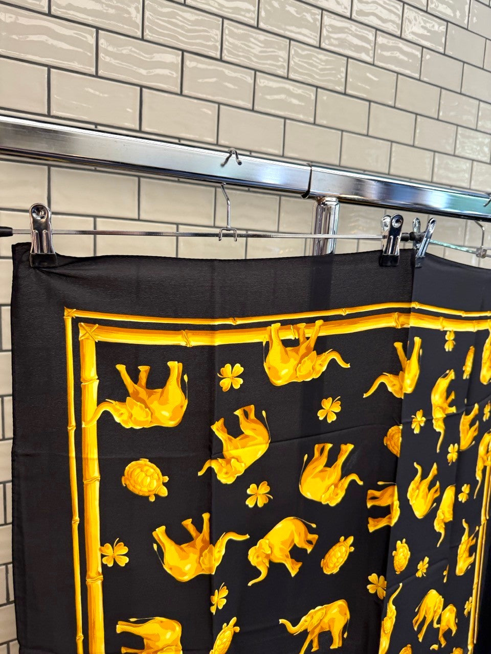 BERLIN VINTAGE CORNER vintage Escada silk scarf in black with golden-yellow elephant, turtle, and clover motif.