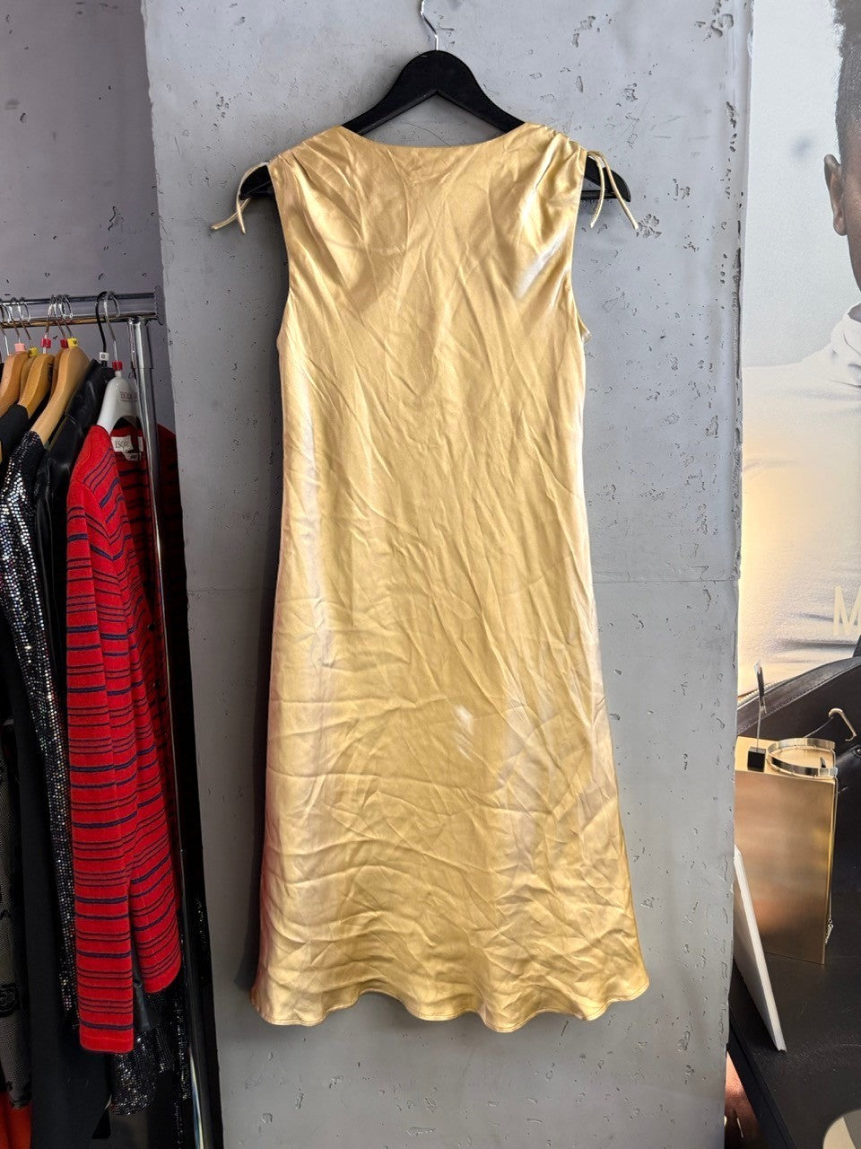 BERLIN VINTAGE CORNER Escada Sport golden-champagne satin midi dress with ruched shoulder details on a hanger.