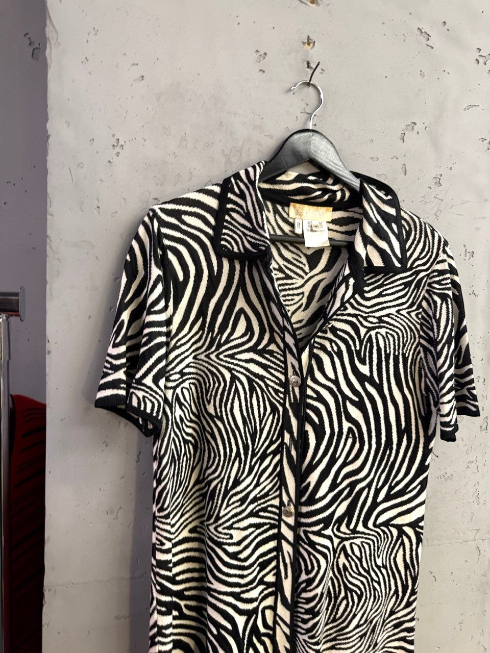 BERLIN VINTAGE CORNER Escada short-sleeve knit button-up shirt in a black and white zebra print pattern.