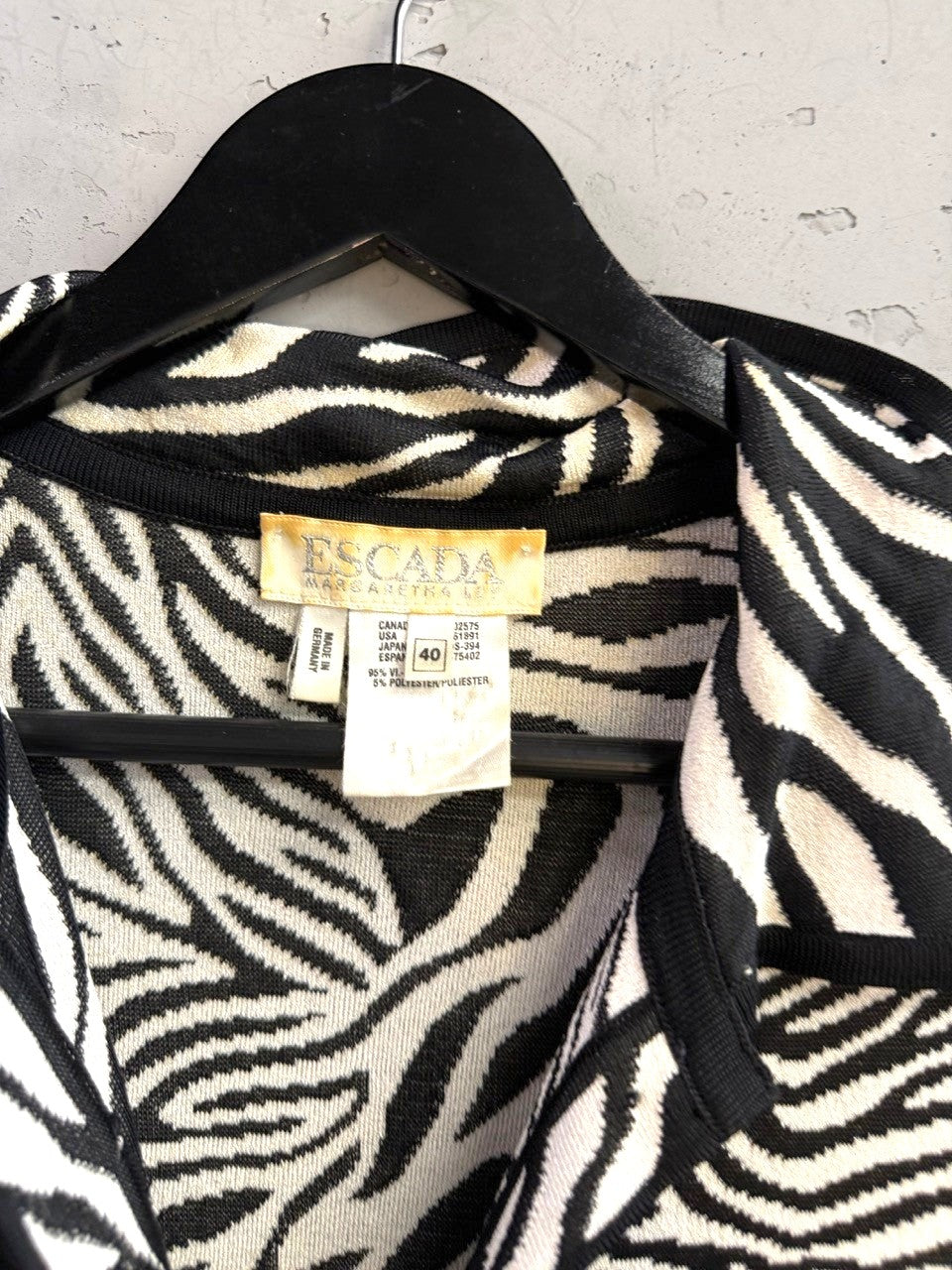 BERLIN VINTAGE CORNER Escada vintage knit button-up shirt featuring a black and white zebra print pattern.