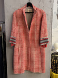 BERLIN VINTAGE CORNER ETRO Milano red and white houndstooth long coat with embroidered cuffs hanging on a rack