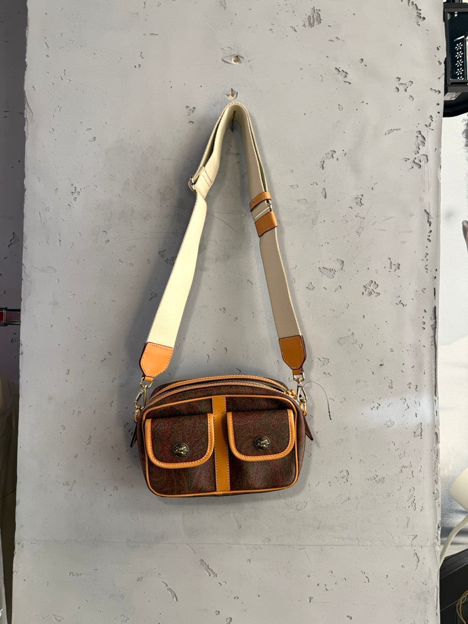 Etro paisley camera bag on its strap