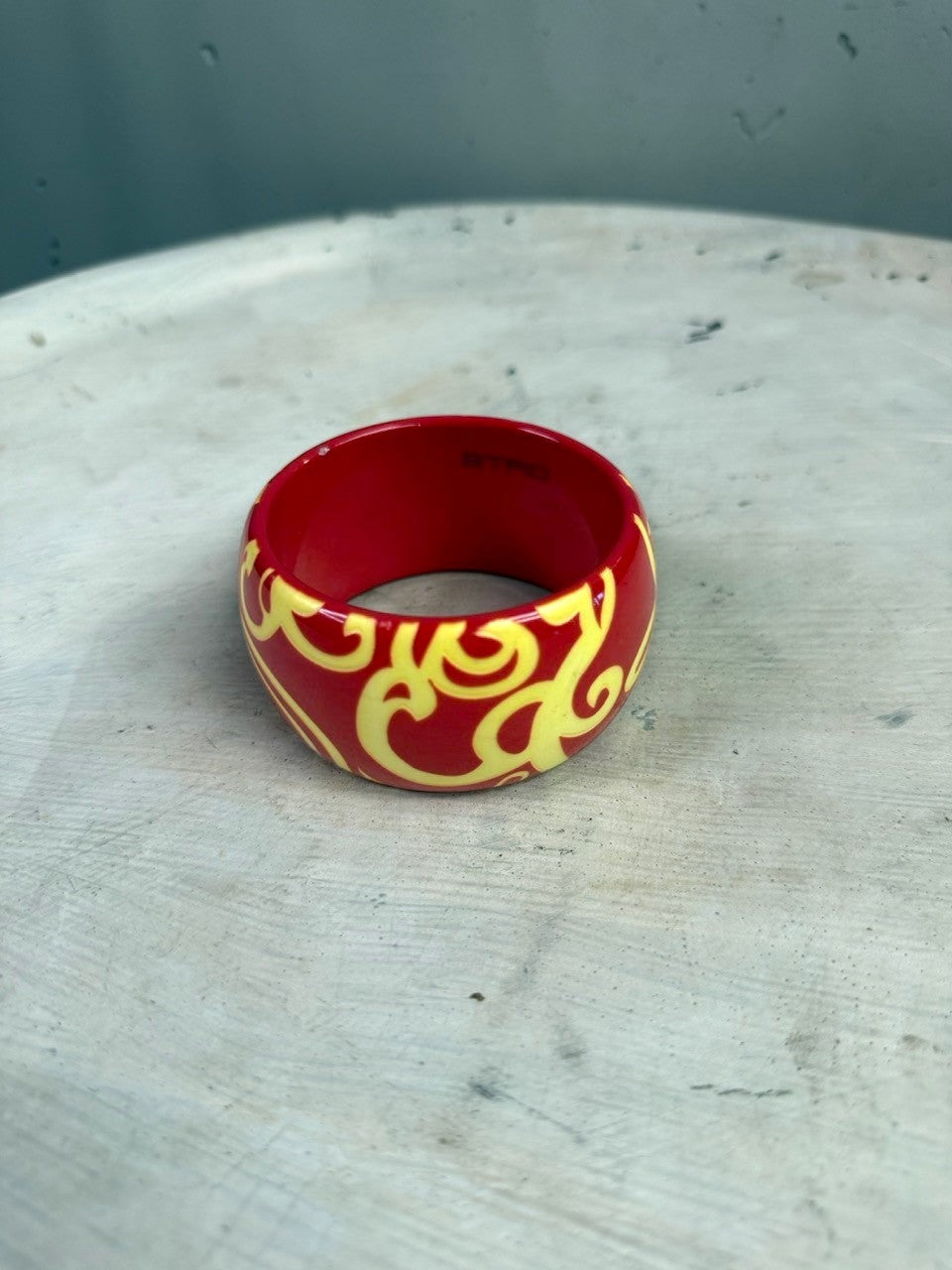 BERLIN VINTAGE CORNER ETRO red resin bangle bracelet with yellow swirling pattern and interior logo stamp