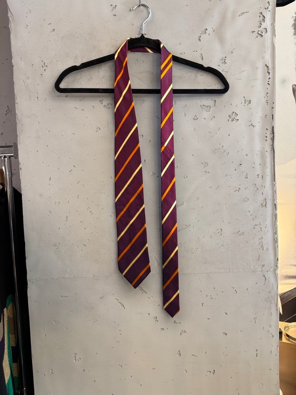 BERLIN VINTAGE CORNER ETRO Milano striped necktie in deep plum with gold and amber diagonal stripes on a hanger