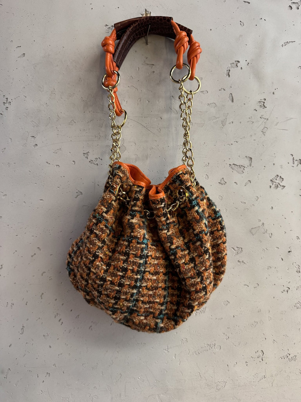 BERLIN VINTAGE CORNER ETRO tweed bucket bag with orange leather trim, gold chain strap, and drawstring closure.