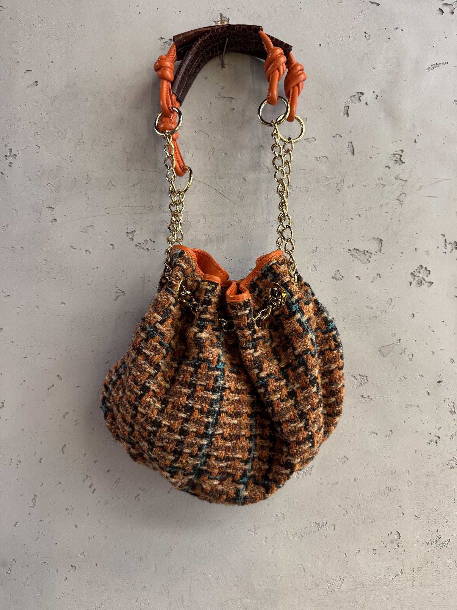 BERLIN VINTAGE CORNER ETRO tweed bucket bag with orange leather trim, gold chain strap, and drawstring closure.