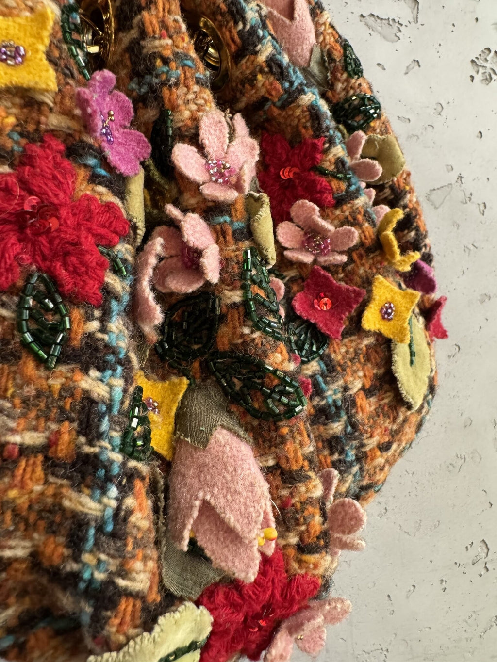 BERLIN VINTAGE CORNER ETRO tweed bucket bag featuring hand-applied felt floral appliqués with beads and sequins.