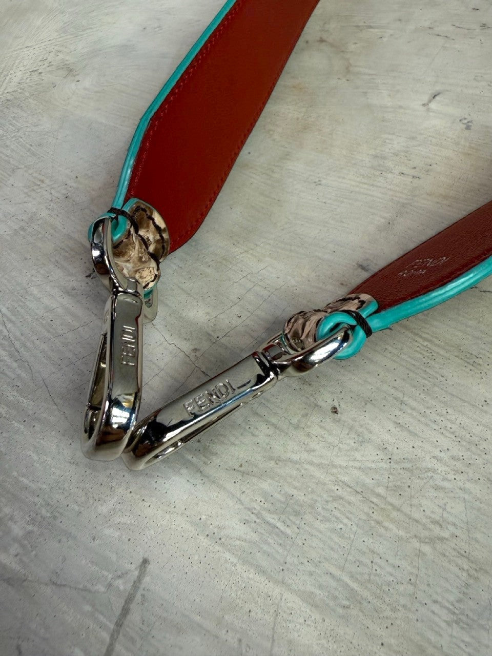 BERLIN VINTAGE CORNER Fendi Roma interchangeable handbag strap in red leather with turquoise trim and silver hardware.
