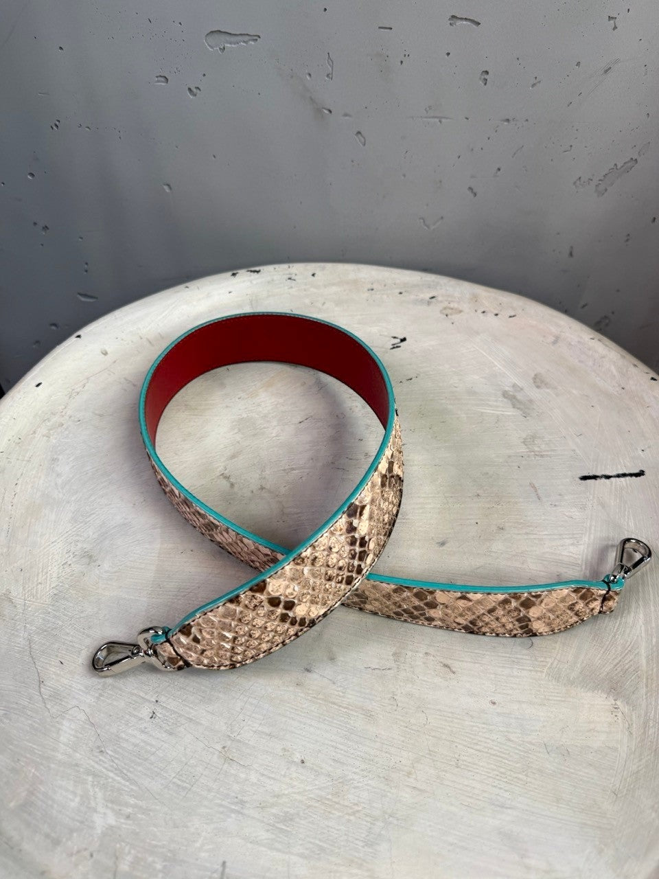 BERLIN VINTAGE CORNER Fendi Roma snakeskin-embossed handbag strap with red leather interior and turquoise trim.
