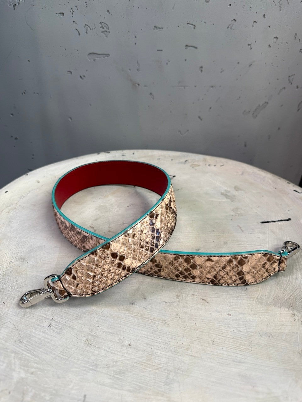 BERLIN VINTAGE CORNER Fendi Roma snakeskin-embossed shoulder strap with red leather lining and turquoise edge trim.