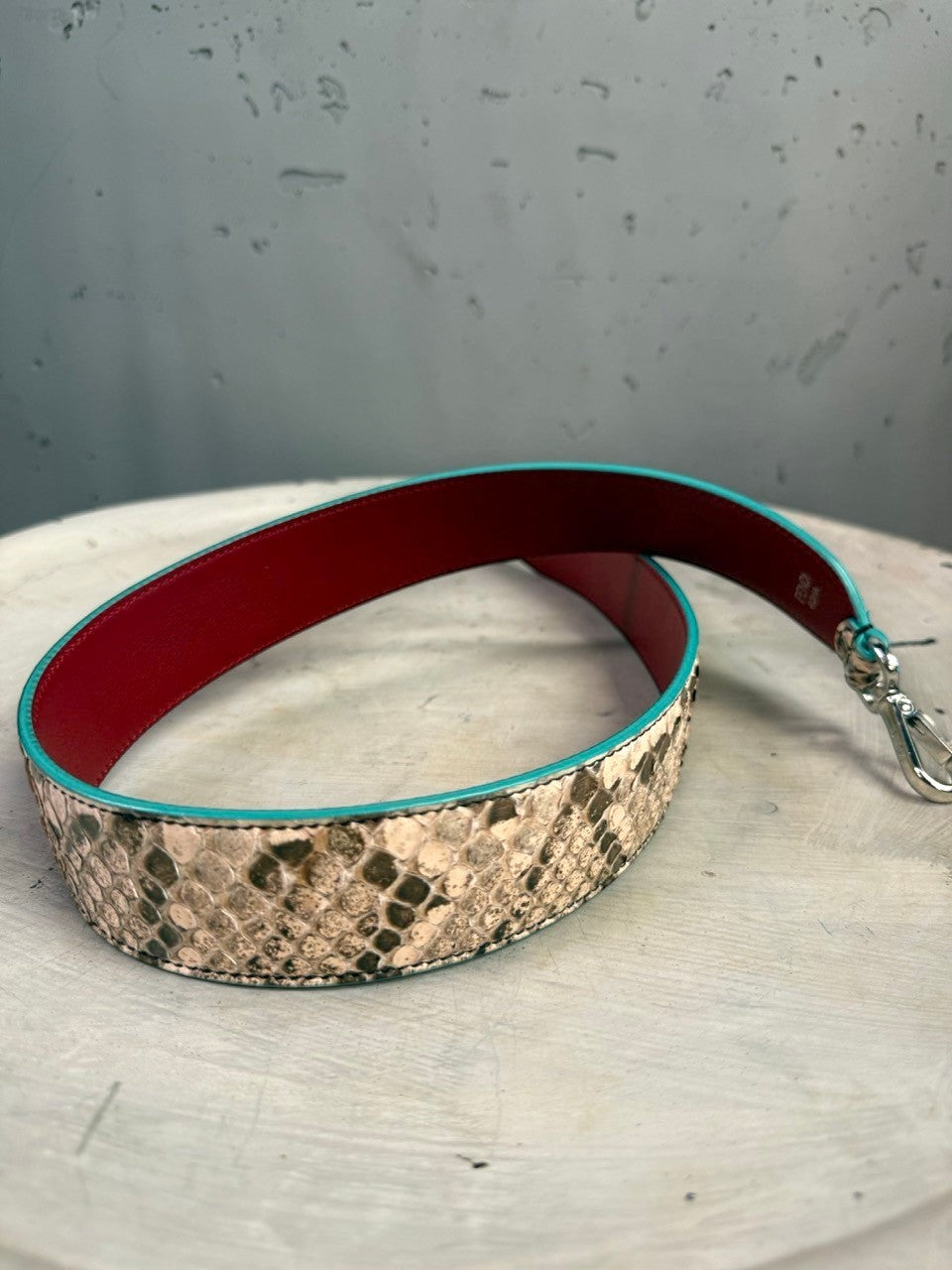 BERLIN VINTAGE CORNER Fendi Roma snakeskin-embossed shoulder strap with red leather lining and turquoise trim.