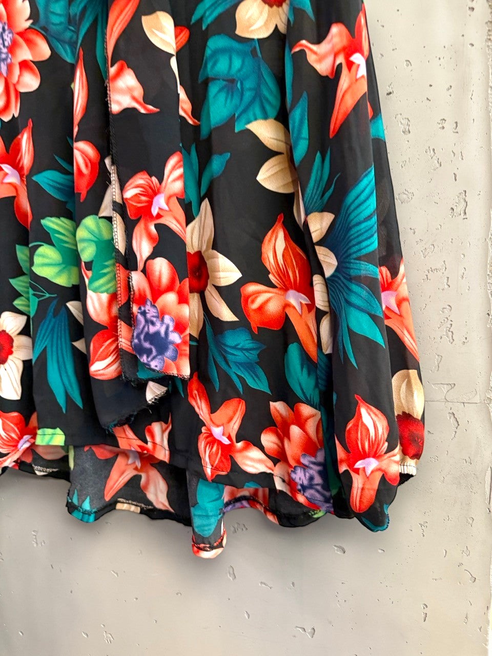BERLIN VINTAGE CORNER long sleeve blouse featuring a vibrant multi-colored tropical floral print on black fabric.
