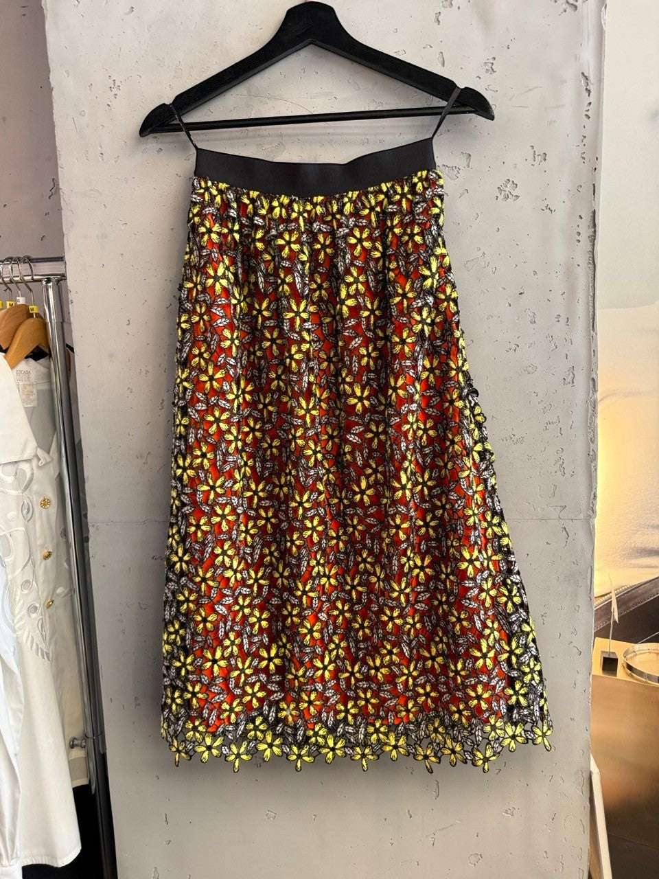 BERLIN VINTAGE CORNER midi skirt with orange lining, yellow floral lace overlay, and elasticated waistband.