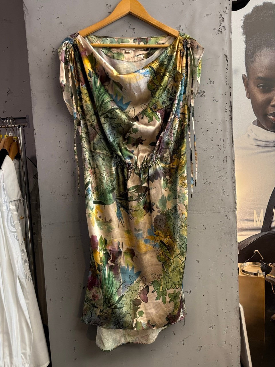 BERLIN VINTAGE CORNER floral print drape neck midi dress with green, blue, purple, and yellow botanical pattern. Lightweight fabric with tie shoulder details.