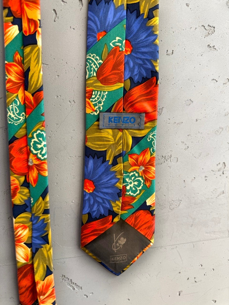 BERLIN VINTAGE CORNER bold floral necktie with navy, green, orange, red, and blue flowers.