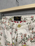 BERLIN VINTAGE CORNER white cotton twill trousers with all-over pink, yellow, and green floral print.