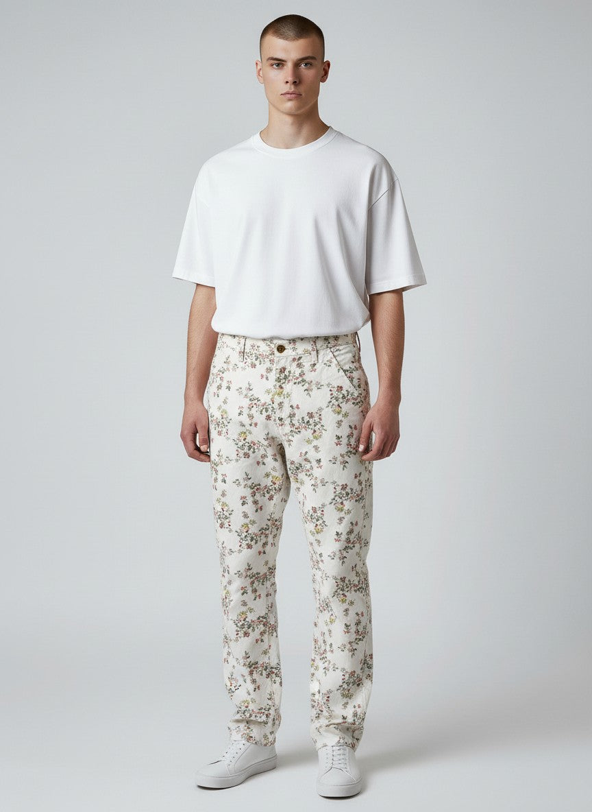 BERLIN VINTAGE CORNER white cotton twill trousers with all-over pink, yellow, and green floral print. Straight leg, mid-rise.