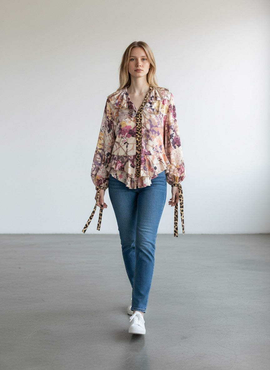 BERLIN VINTAGE CORNER floral print long sleeve blouse with ruffled neckline and leopard print accents.
