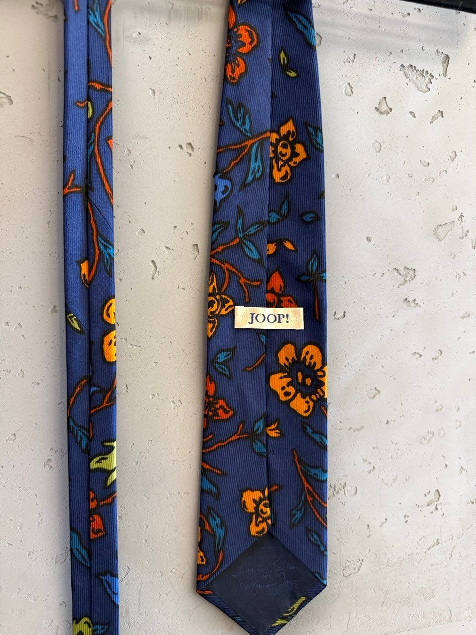 BERLIN VINTAGE CORNER navy blue tie with orange and yellow floral pattern, textured fabric