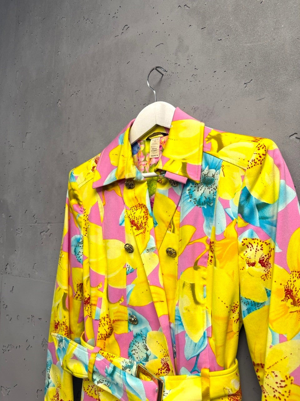 BERLIN VINTAGE CORNER yellow, pink, blue floral print double-breasted trench coat with gold buttons and belt.