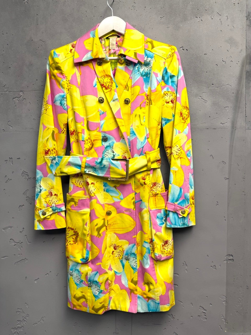 BERLIN VINTAGE CORNER yellow, pink, and blue floral print double-breasted trench coat with belt and gold buttons.