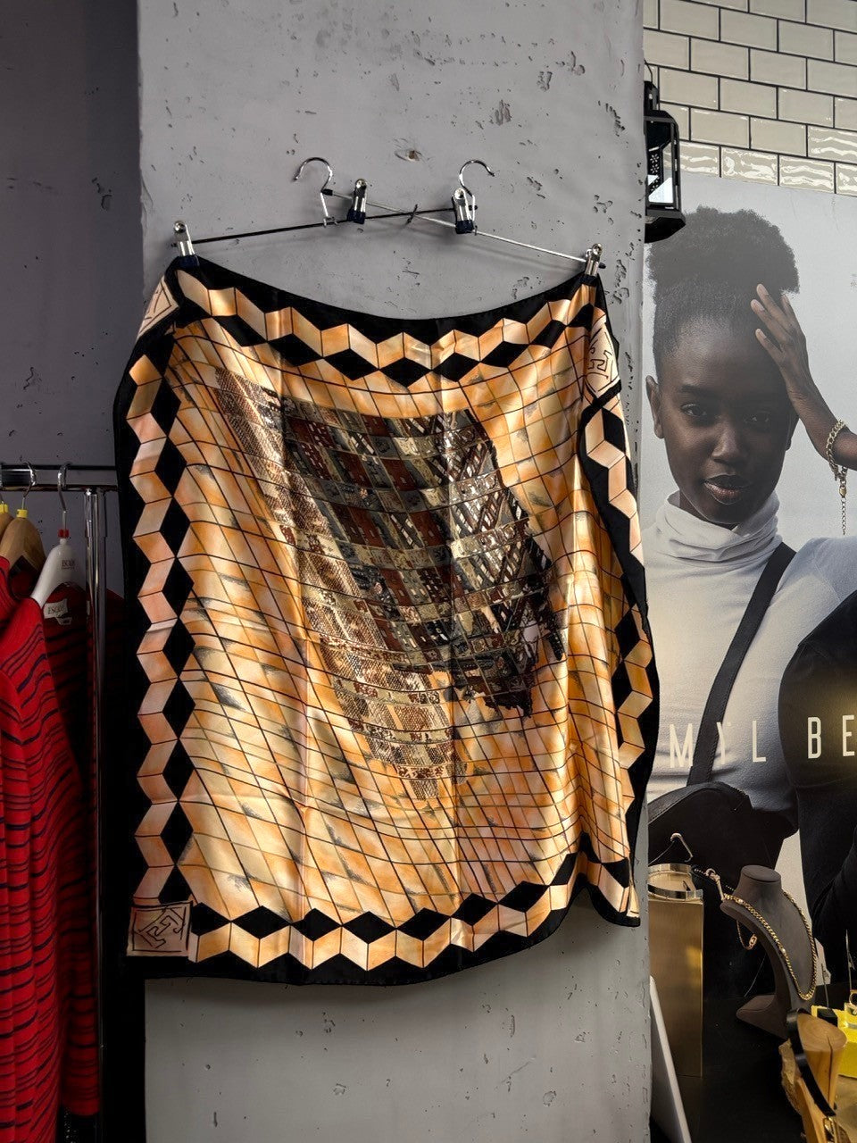 BERLIN VINTAGE CORNER silk scarf featuring a geometric grid pattern in peach, black, and earth tones with a border.