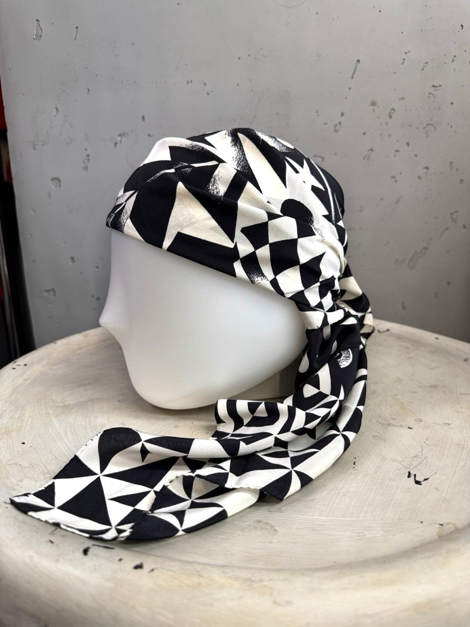 BERLIN VINTAGE CORNER black and white geometric silk scarf styled as a head wrap on a mannequin