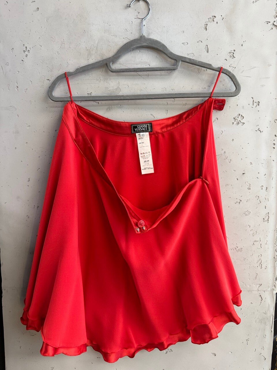 Gianni Versace red silk camisole, full view on a hanger