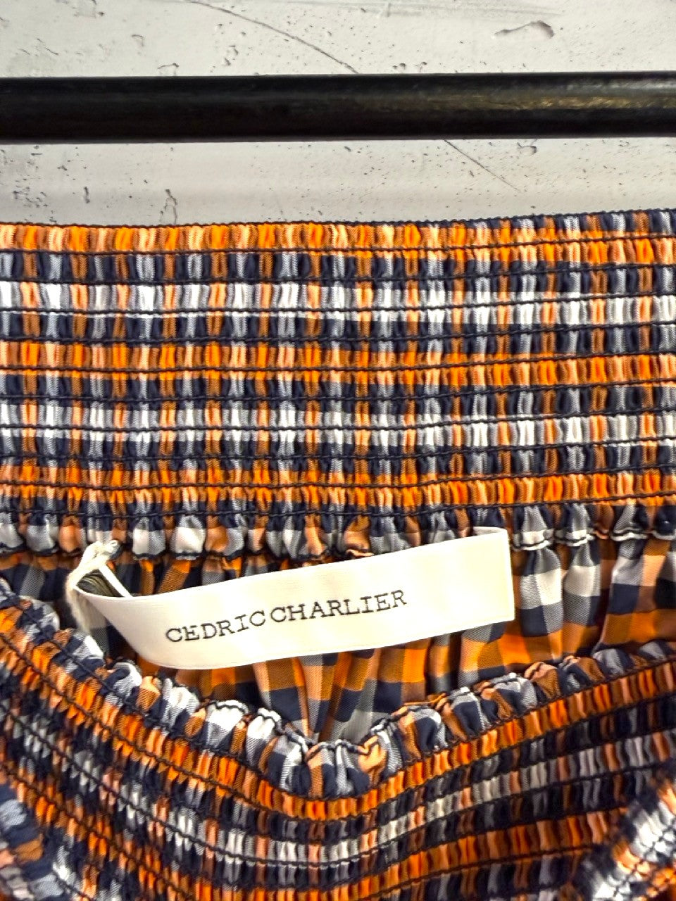 BERLIN VINTAGE CORNER orange, white, and black gingham check midi skirt with smocked waistband.