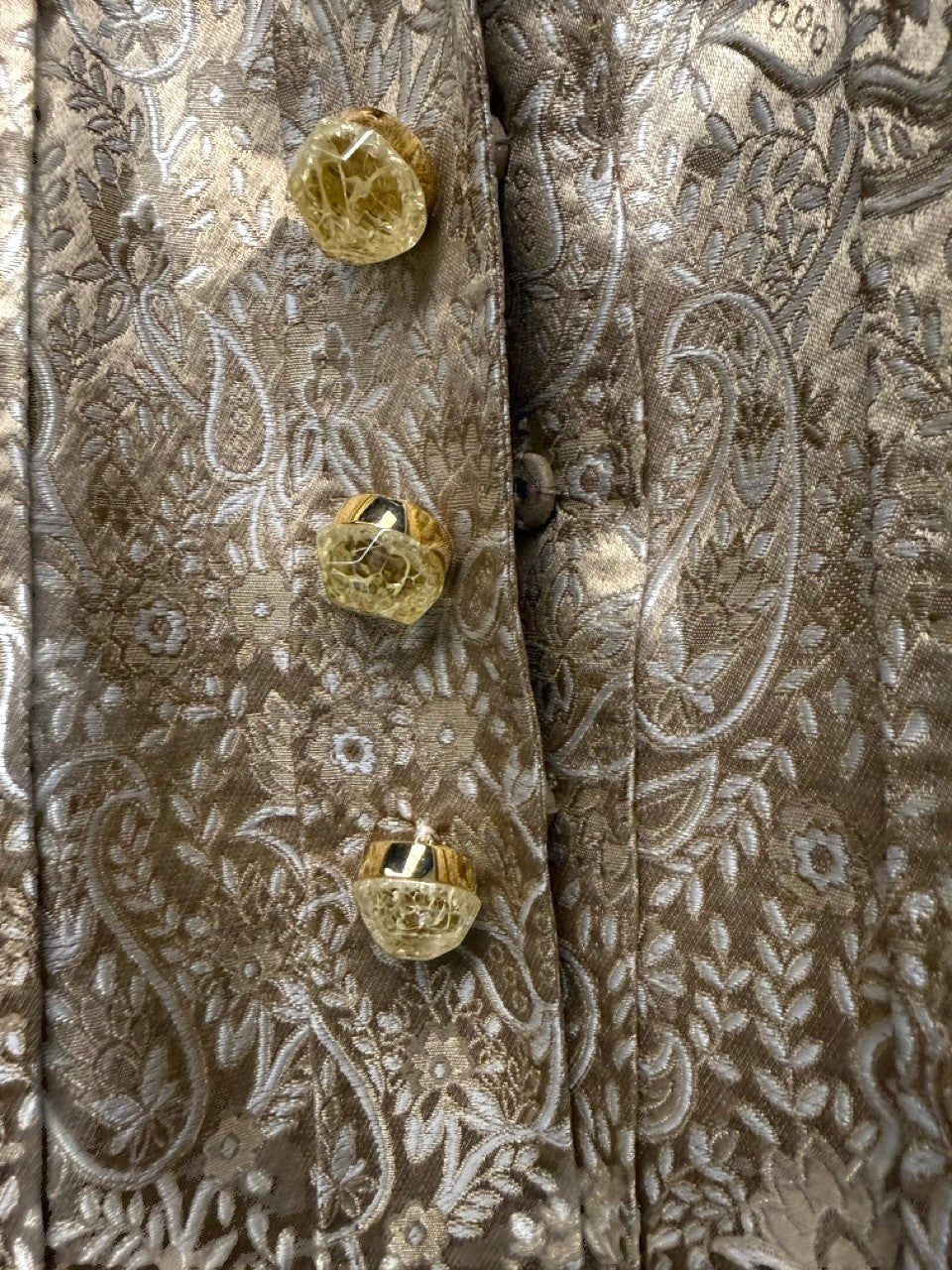 BERLIN VINTAGE CORNER gold brocade jacket with paisley pattern and ornate buttons.