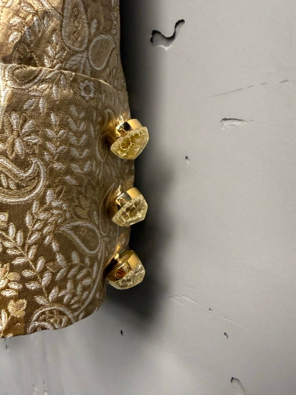 BERLIN VINTAGE CORNER gold brocade jacket with paisley pattern and ornate gold-toned buttons.