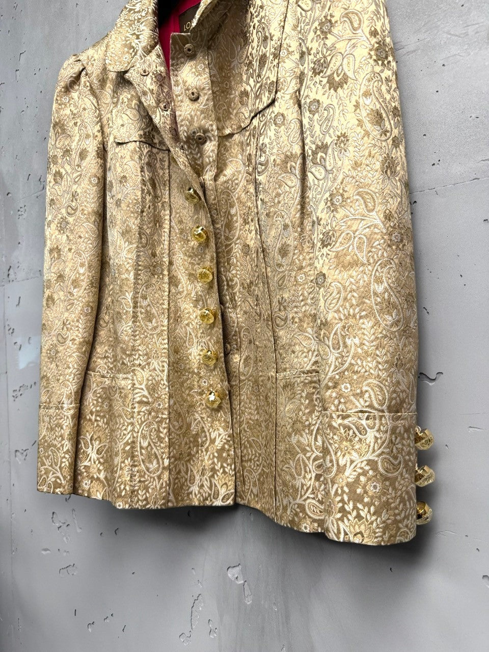 BERLIN VINTAGE CORNER gold brocade paisley pattern jacket with ornate buttons and fuchsia lining.