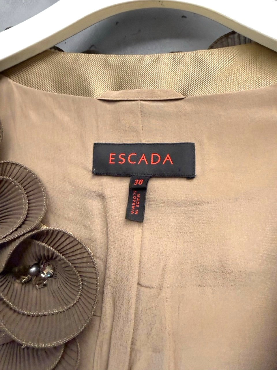 BERLIN VINTAGE CORNER Escada gold-toned blouse with brown floral appliqué and crystal embellishments on neckline.