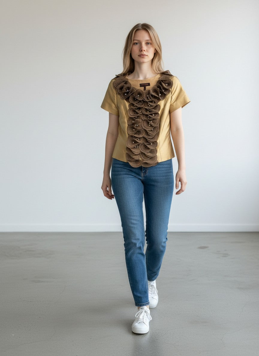 BERLIN VINTAGE CORNER gold-toned short-sleeved blouse with brown floral appliqué and crystal embellishments on the neckline and front.