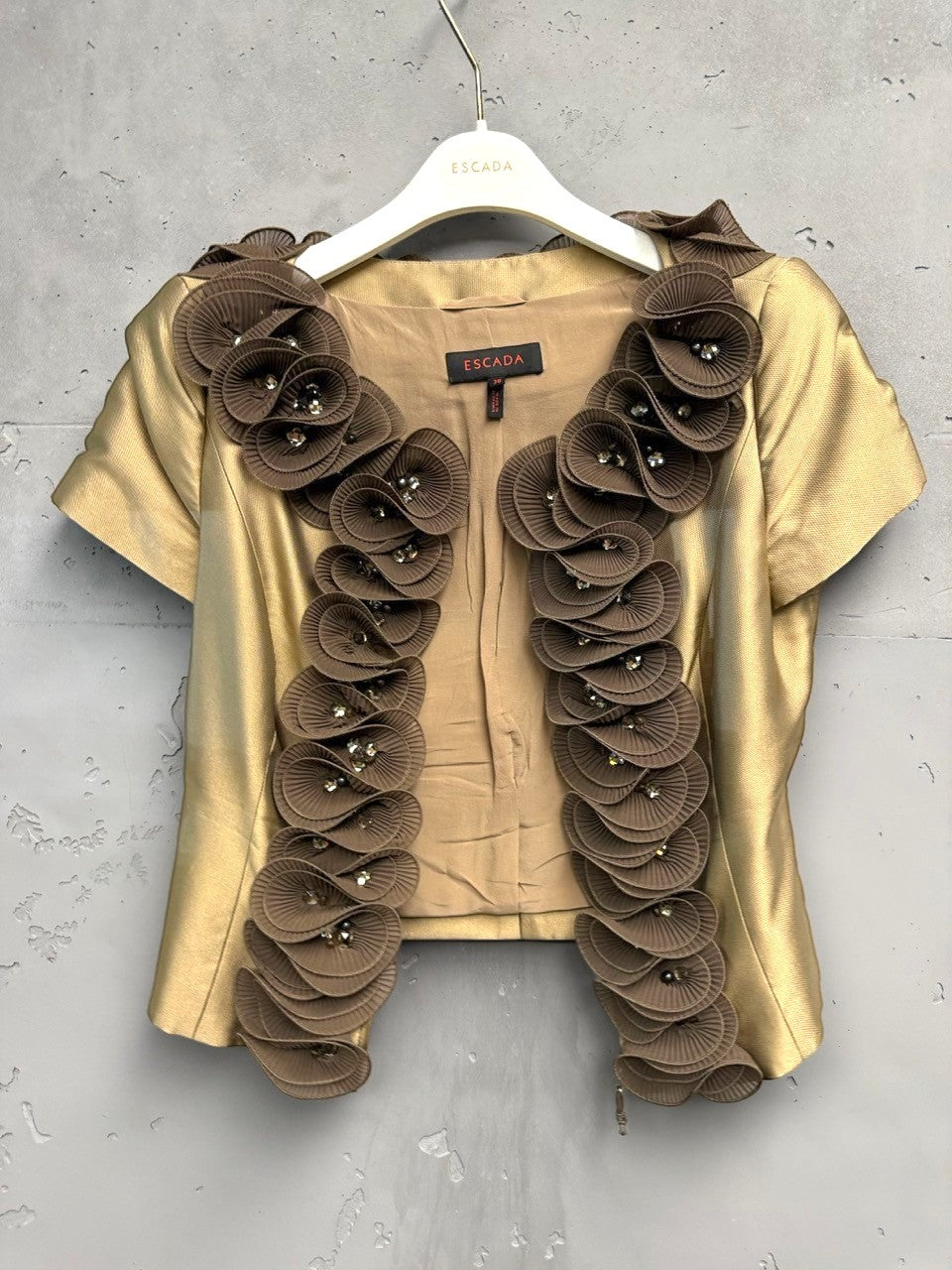 BERLIN VINTAGE CORNER gold-toned short-sleeved blouse with brown floral appliqué and crystal embellishments on the neckline.