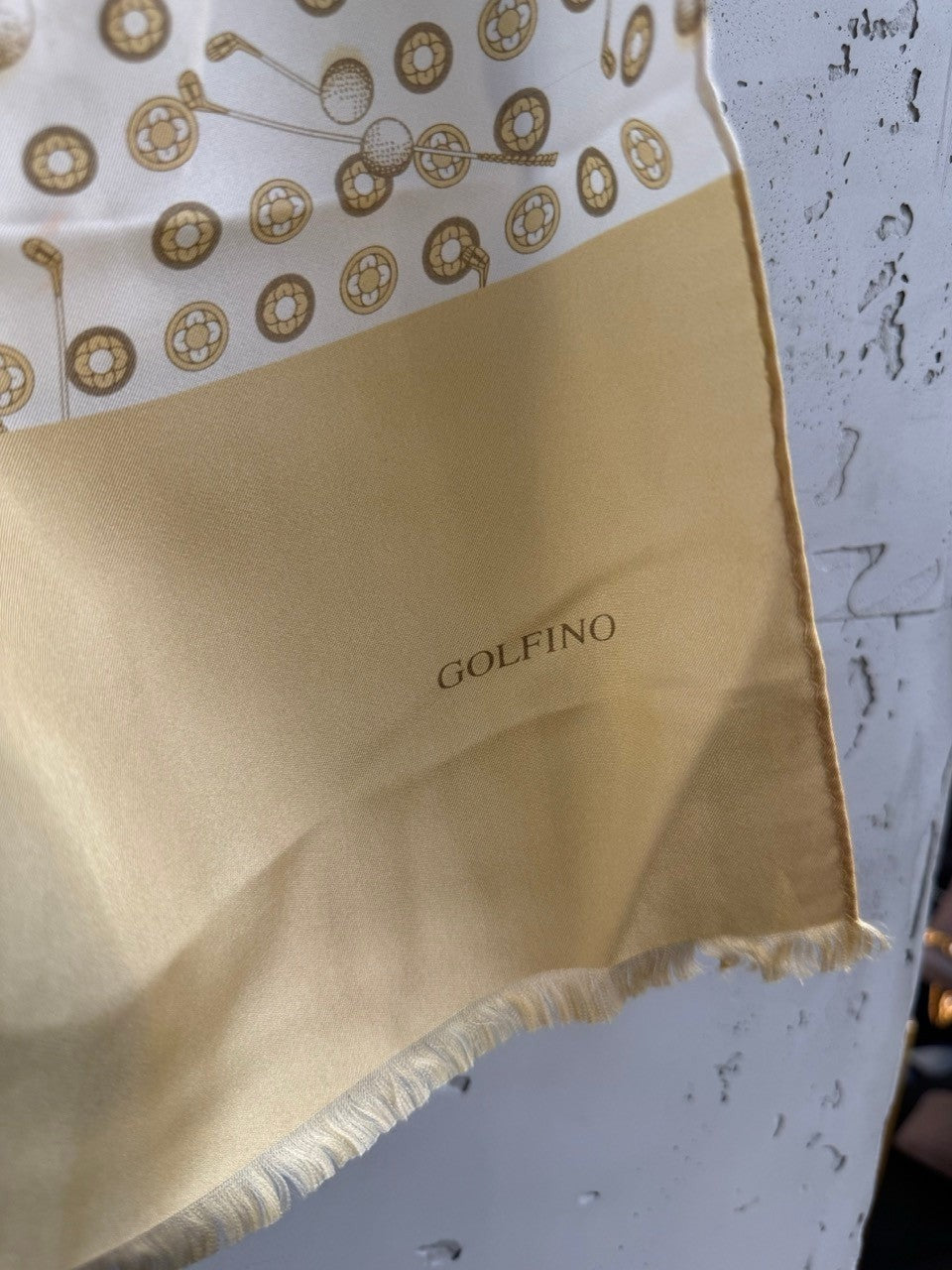 BERLIN VINTAGE CORNER GOLFINO cream and gold silk scarf with golf club motifs and frayed edges.