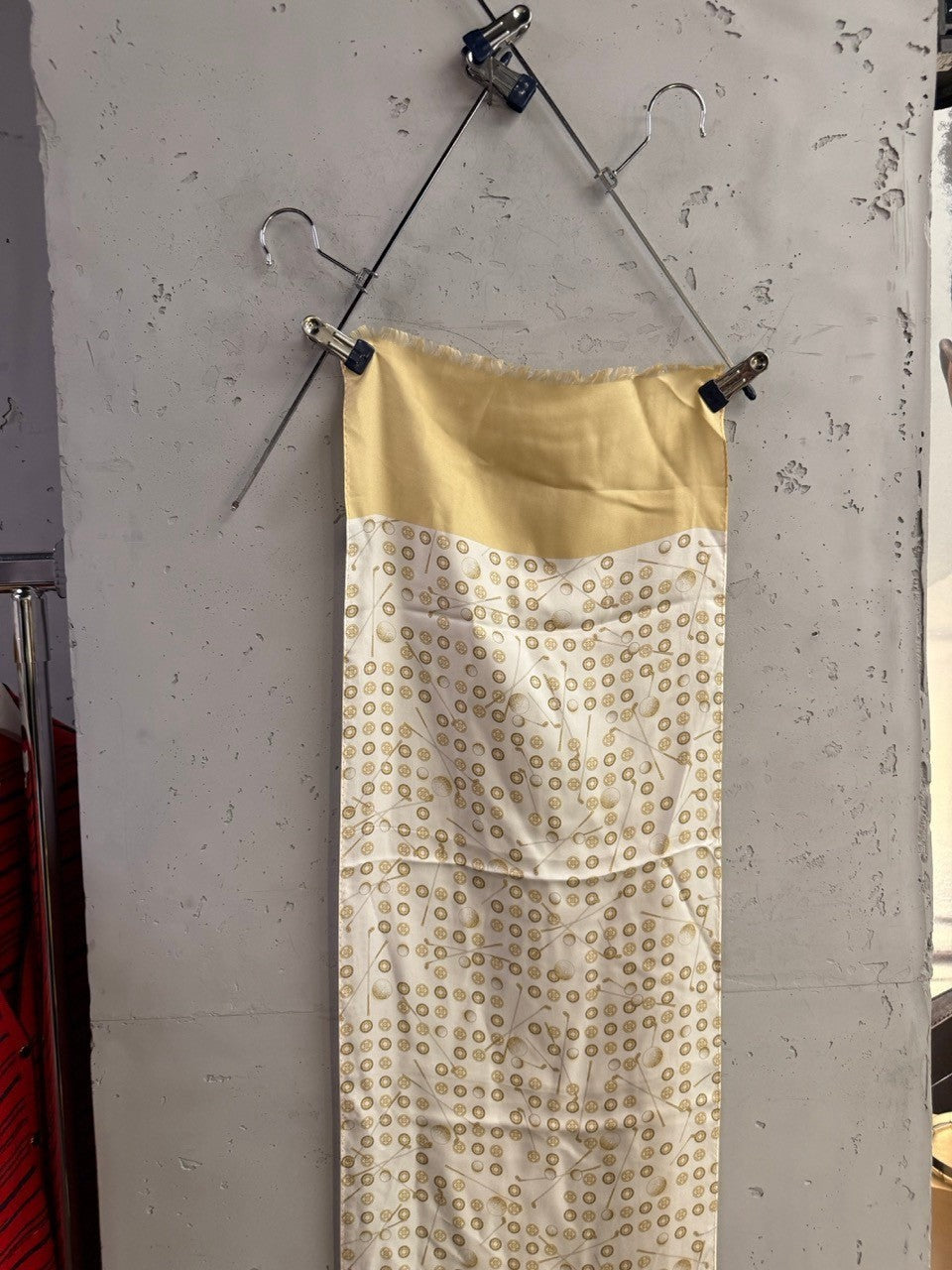 BERLIN VINTAGE CORNER Golfino silk scarf in cream and gold with golf club and ball pattern and frayed edges.