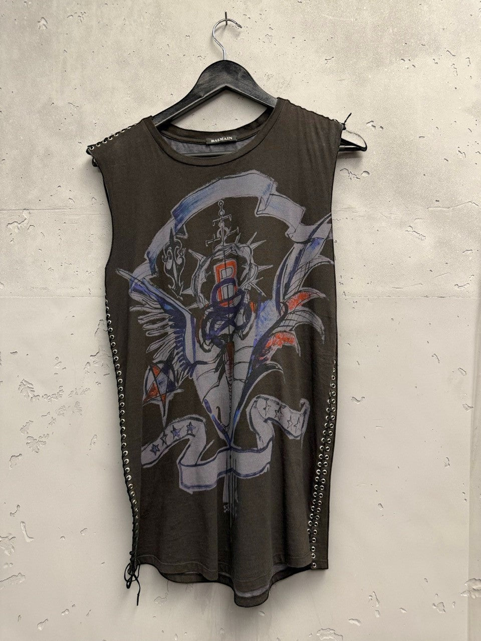 BERLIN VINTAGE CORNER dark grey cotton sleeveless top with graphic crest print and side grommet lacing detail.