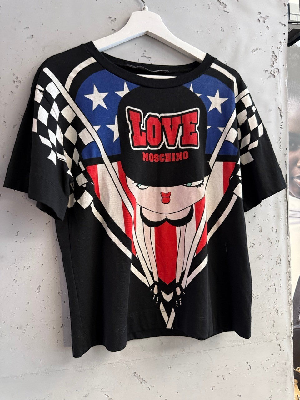 BERLIN VINTAGE CORNER black cotton t-shirt with graphic print featuring American flag elements, checkered pattern, and cartoon character.
