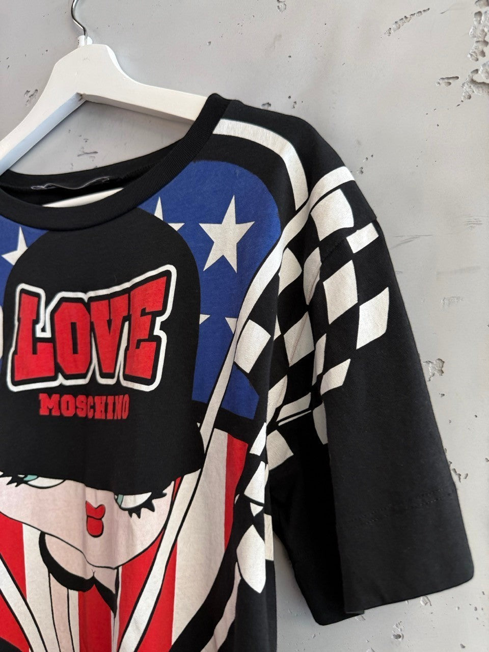 BERLIN VINTAGE CORNER black cotton t-shirt with graphic print featuring Betty Boop, American flag elements, and "LOVE MOSCHINO" logo.