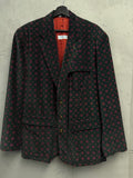 BERLIN VINTAGE CORNER deep green corduroy blazer with red geometric print, two-button closure, and flap pockets.