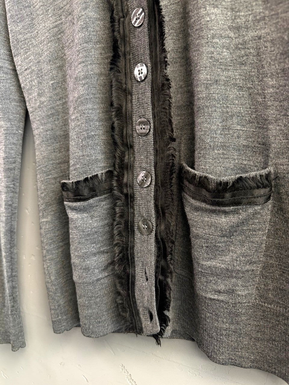 BERLIN VINTAGE CORNER grey fine-knit cardigan with embellished button front and textured trim. Features two pockets.