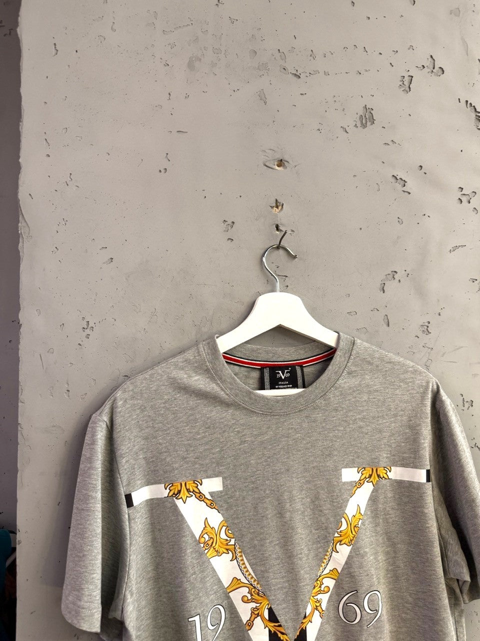 BERLIN VINTAGE CORNER heather grey cotton t-shirt with a bold gold baroque V graphic print and 1969 branding.