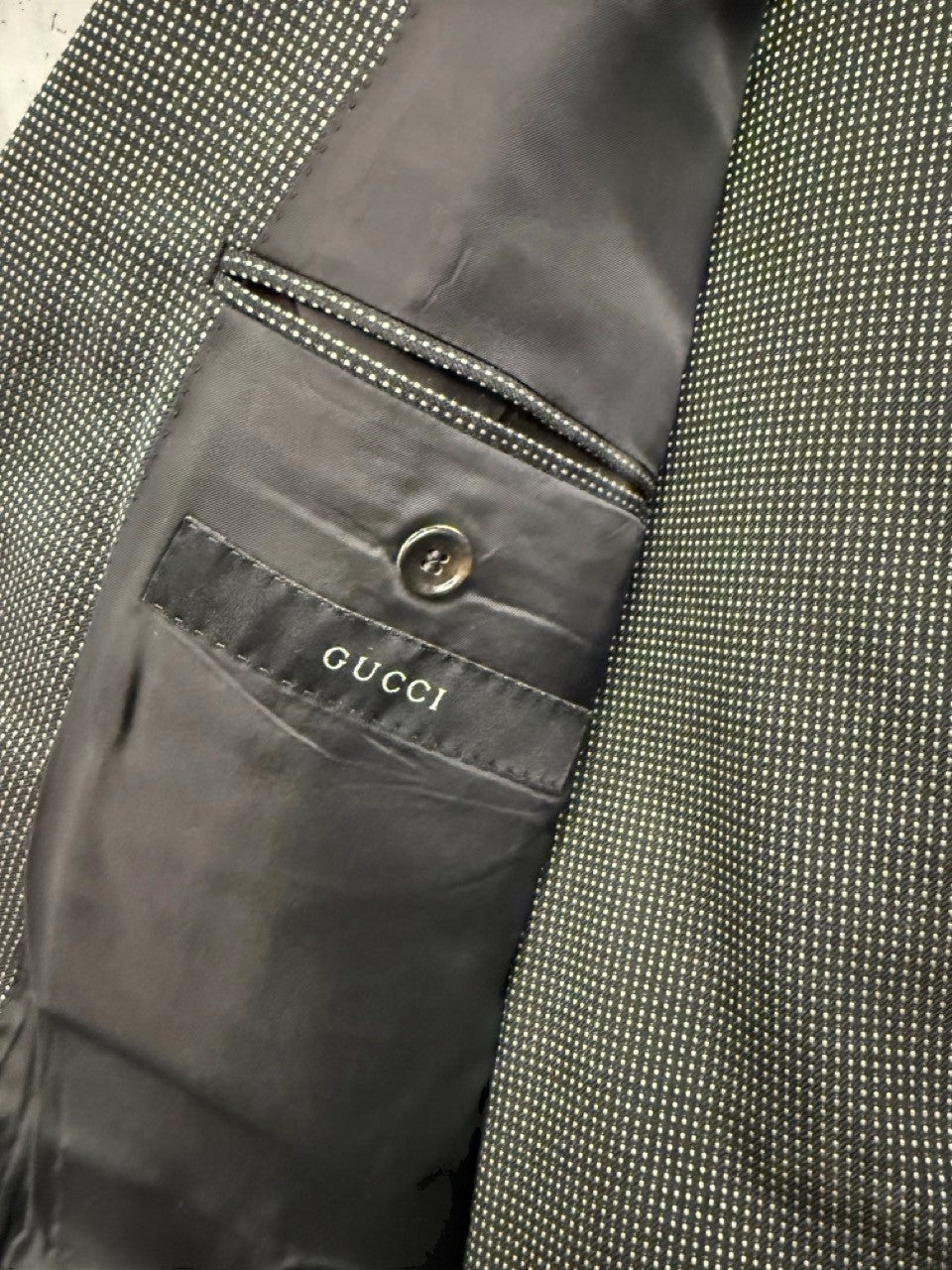 BERLIN VINTAGE CORNER grey micro-dot wool blend suit jacket interior with Gucci label and button detail.