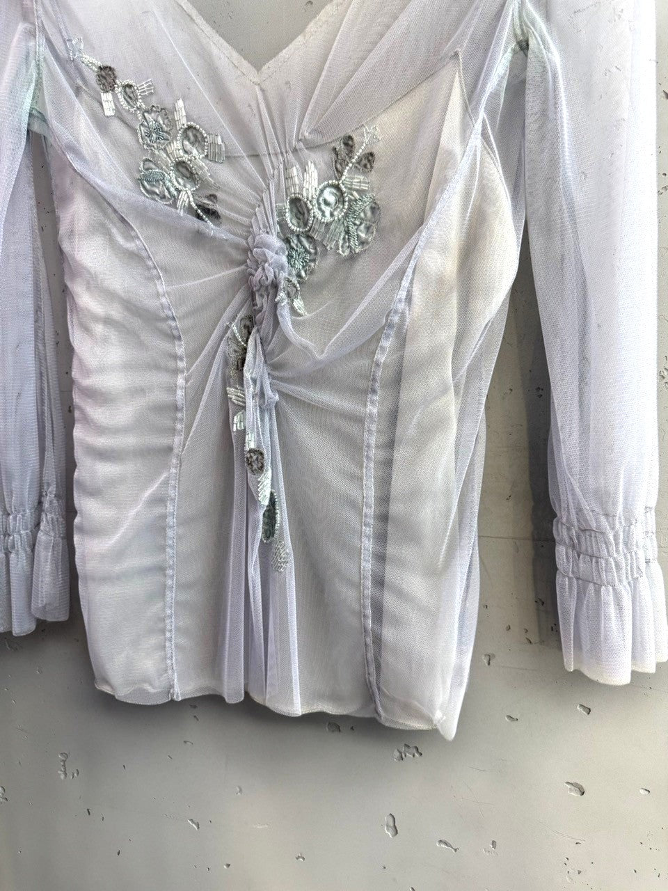 BERLIN VINTAGE CORNER sheer grey tulle long sleeve blouse with intricate beadwork and gathered waist detail.