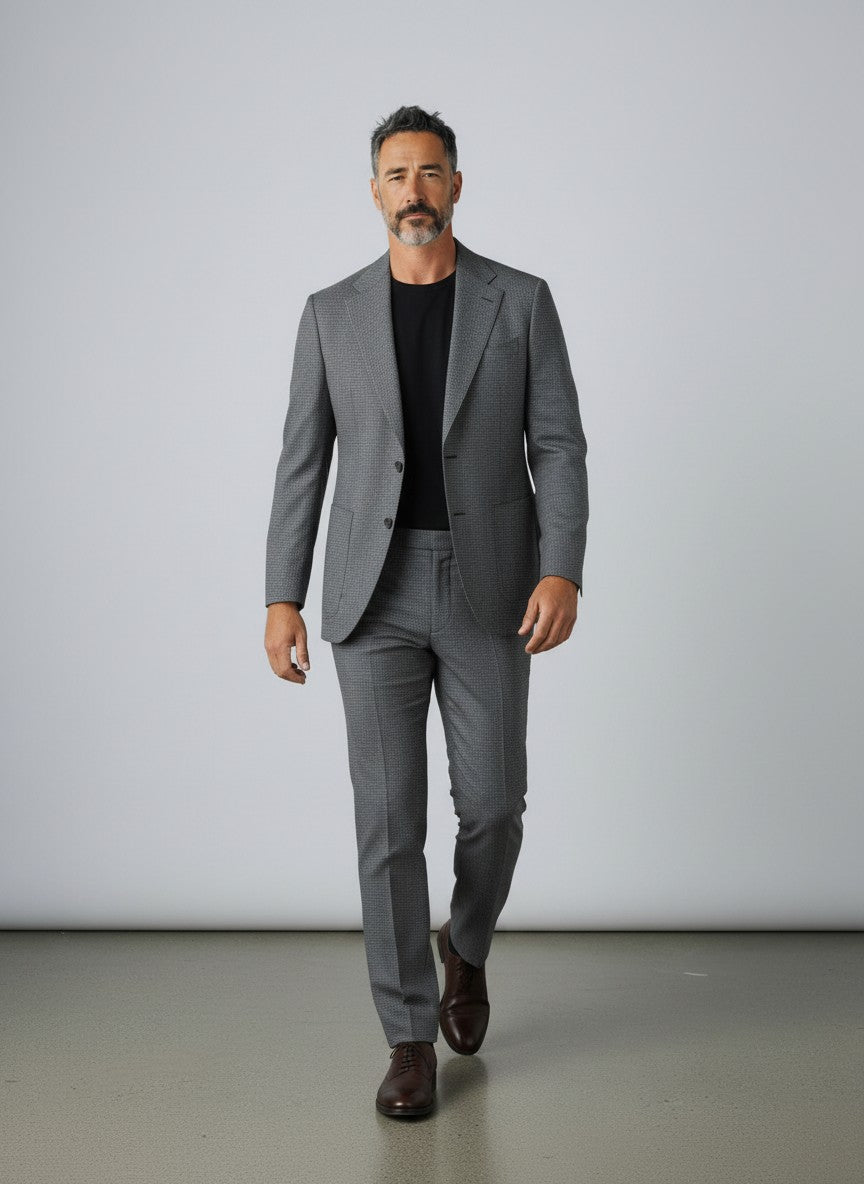 BERLIN VINTAGE CORNER grey micro-dot wool blend two-piece suit with notched lapel and two-button closure.